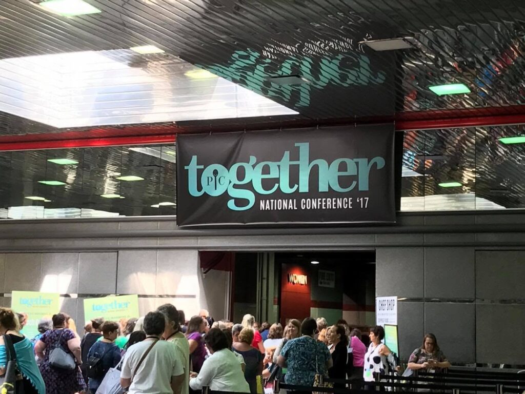 Pampered Chef Together National Conference 2017 entrance with attendees gathered below the conference sign